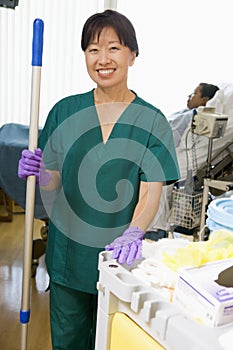 An Orderly Cleaning A Hospital Ward photo