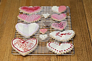 Orderly Valentine's Day heart cookies on a cooling rack set on a