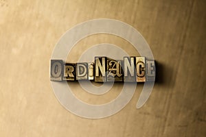 ORDINANCE - close-up of grungy vintage typeset word on metal backdrop