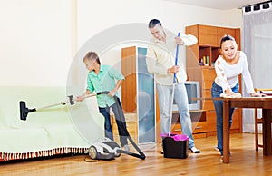 Ordinary family doing house cleaning