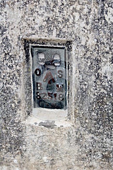 The Ordnance Survey Bench Mark on the side of a British triangulation point, or Trig Point