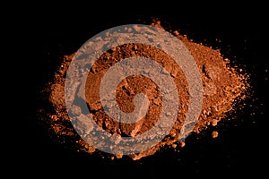 Ore from a diamond mine. isolated on black background with reflexion.