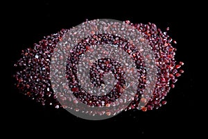 Ore from a diamond mine. isolated on black background with reflexion.