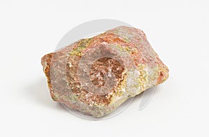 Ore Unakite on white background, First discovered in the United States in the Unakas mountains of North Carolina from which it get