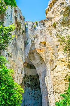 Orecchio di Dionisio cave in the Neapolis Archaeological Park in Syracuse, Sicily, Italy photo