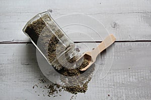 Oregano: dried, dehydrated on an old wooden table. Top view.