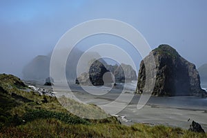 Oregon Coast Rocky Landscape on Pacific Ocean Beach in Light Fog