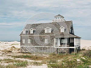 Oregon Inlet Lifesaving Station with sandy dunes, in the Outer Banks, North Carolina