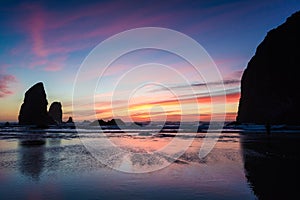 Oregon sunset between the needles and the haystack at cannon beach