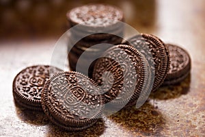 Oreo cookies on dark brown background