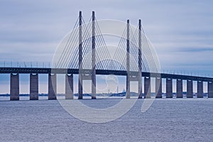The Oresund Bridge, the bridge and underwater tunnel connecting Malmo, Sweden with Copenhagen, Denmark. Blue sky and