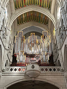 Organ and beautiful ornate ceiling in Almudena Cathedral. Madrid, Spain.