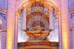 organ with details of the pipes inside the national pantheon, church of santa engracia, colored lighting.