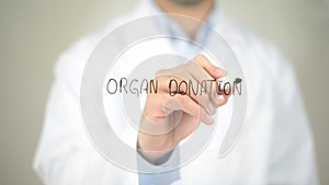 Organ Donation , Doctor writing on transparent screen photo