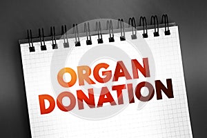 Organ Donation - process of surgically removing an organ or tissue from one person and placing it into another person, text on photo