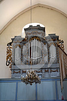 Organ inside the church. Ruins of medieval cistercian abbey in Transylvania.