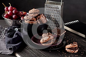 Organic almond cookies on dark wooden background
