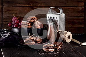 Organic almond cookies on dark wooden background with chocolate