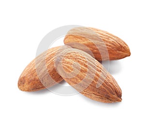 Organic almond nuts on white background.