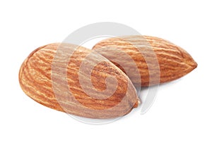 Organic almond nuts on white background.