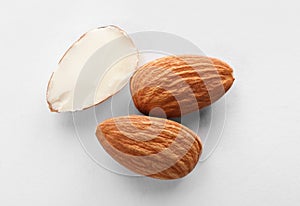 Organic almond nuts on white background, top view