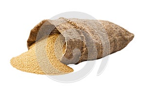 Organic amaranth in sack isolated on white background. Grains are scattered out of the bag
