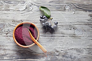 Aronia powder in a bowl photo