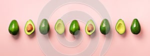 Organic avocado with seed, avocado halves, whole fruits on pink background. Top view. Banner, seamless pattern. Pop art design, cr