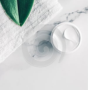 Organic beauty cosmetics on marble, home spa flatlay background