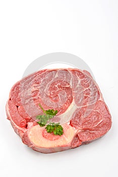 organic beef shin steak and white background