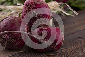 Organic Beetroot,red beetroot with herbage green leaves on rustic background