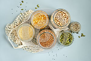 Organic bio bulk products. Foods storage in kitchen at low waste lifestyle. Cereals and grains in glass jars on table