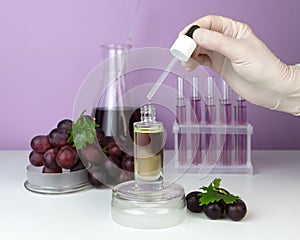 Organic bio grape cosmetics. Extract, grape seed oils, serum. Abstract cosmetic laboratory