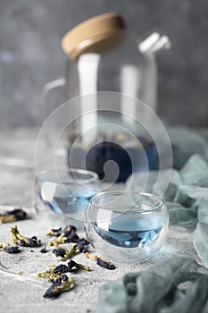 Organic blue tea Anchan, Clitoria, Butterfly Pea in a teapot and a cups