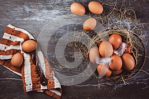 Organic brown eggs in a basket on kitchen table