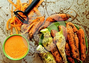 Organic carrots and carrot juice on a vintage table photo