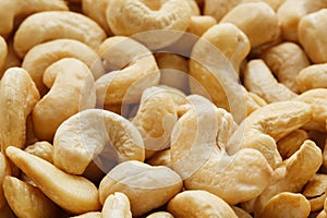 Organic cashew without shell on the background. Organic golden walnut closeup.