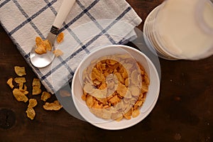 Organic cereals food for breakfast on wood table milk metal spoon