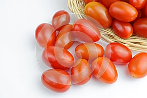 Organic cherry tomato, solanum lycopersicum L. var. cerasiforme in basket.