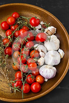 Organic cherry tomatoes with fresh garlic and spices