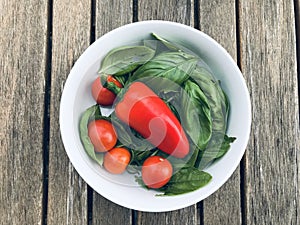 Organic cherry tomatoes, green basil and red pepper