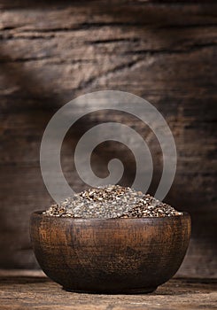 Organic chia seeds in the wooden bowl - Salvia hispÃÂ¡nica photo