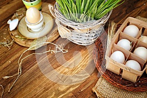 Organic chicken eggs in egg box against old style wooden background