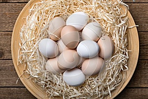 Organic chicken eggs in nest closeup