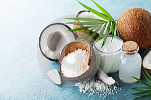 Organic coconut products for spa, cosmetic or food ingredients decorated palm leaves. Natural oil, water and shavings.