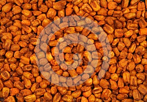Organic corn nuts with sauce. For texture or background.