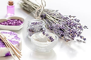 organic cosmetic with lavender flowers and oil on white background