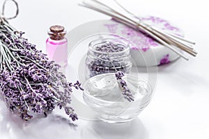 Organic cosmetic with lavender flowers and oil on white background