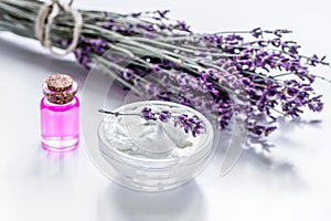 organic cosmetic with lavender flowers and oil on white background