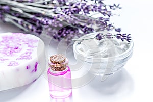 Organic cosmetic with lavender flowers and oil on white background